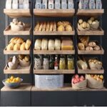 A large showcase in a bakery with bread and other products. Bakery products