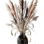 Bouquet of tall dry grass in a black vase