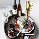 Cheese plate with sausages and wine. Alcohol