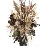 Beautiful lush bouquet of dried flowers in a vase with hydrangea, pampas Lunn