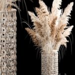 Bouquet of white dried flowers in a wicker basket, reeds, pampas grass, Cortaderia. 256.